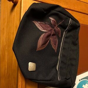 Haiku Black and Brown Toiletry Bag with Leaf Design